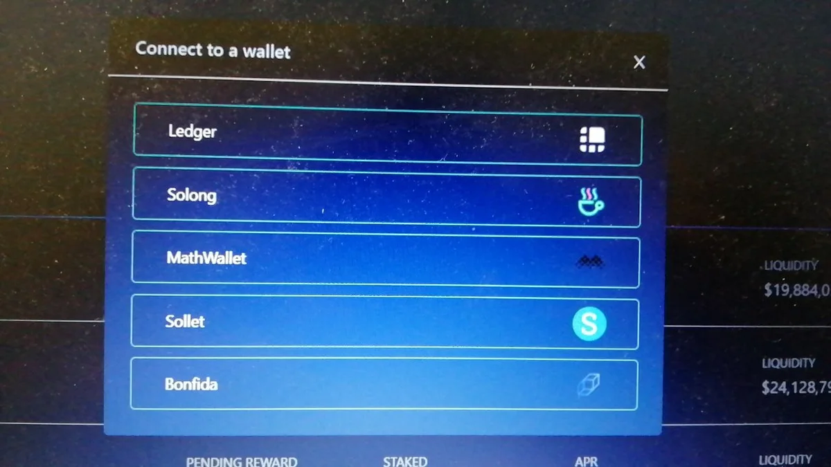 Raydium's Connect to a wallet dialog on a laptop screen in March 2021, listing Ledger, Solong, MathWallet, Sollet and Bonfida.